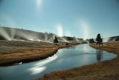 The firehole river flowing under the stars way from the artemisia trail lit by the moon light.