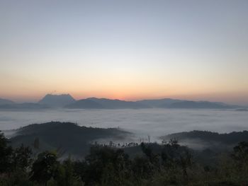 Scenic view of mountains against sky during sunset