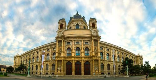 Low angle view of historic building against cloudy sky