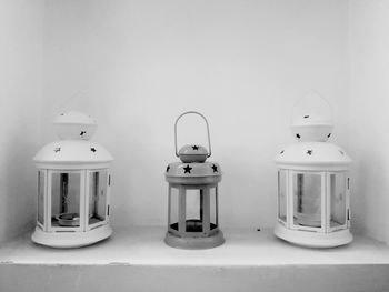 Close-up of lanterns against wall