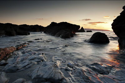 View of beach at sunset