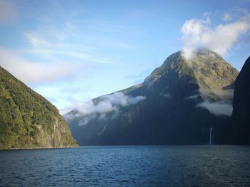 Scenic view of mountains against cloudy sky