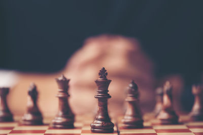 Close-up of chess pieces on table at home