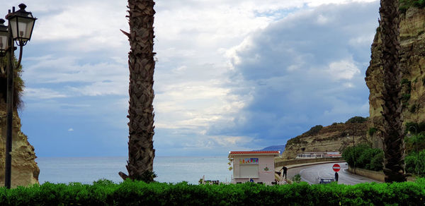 Panoramic view of buildings and trees against sky