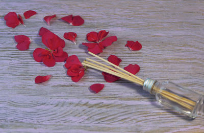 Close-up of red rose on table