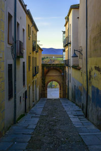 Looking up at a vertical view of distant hills from street in segovia, spain