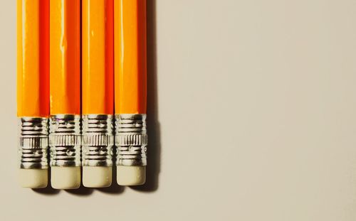 Close-up of yellow pencils arranged on table