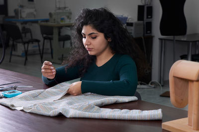 Woman sewing clothes