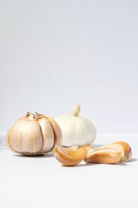 Close-up of pumpkins against white background