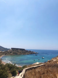 Scenic view of beach against clear sky