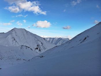 Scenic view of snowcapped mountains against sky