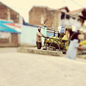 Bicycle on road against wall