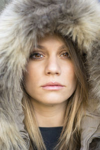 Close-up portrait of woman in snow