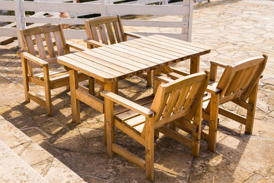 High angle view of empty chairs and table