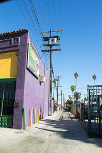 Road against clear blue sky