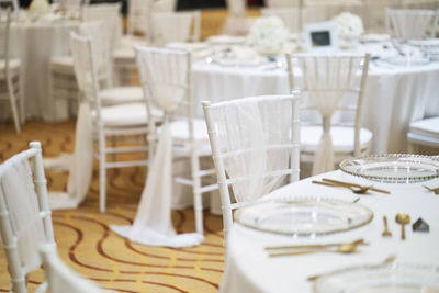 Empty chairs and tables in restaurant