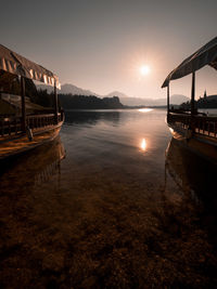 Scenic view of lake against sky during sunset