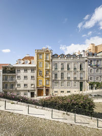 Buildings in city against sky