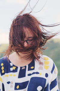 Close-up portrait of smiling young woman