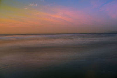 Scenic view of sea against sky at sunset