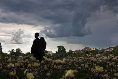 Scenic view of field against cloudy sky