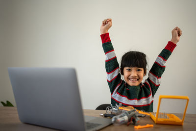 Woman using laptop on table