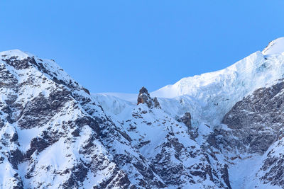 Shot of snow covered himalayas from the zero point of the pindari glacier hike in october 2018.