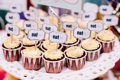Eat me text on cupcakes