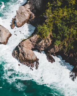 High angle view of rocks in sea