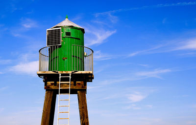 Low angle view of lookout tower against blue sky