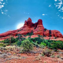 Rock formations on landscape against sky