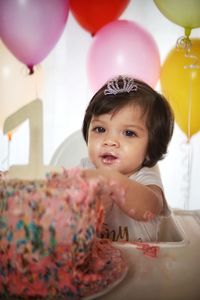 Cute girl having cake in party