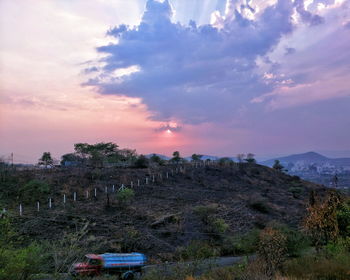 Scenic view of landscape against cloudy sky