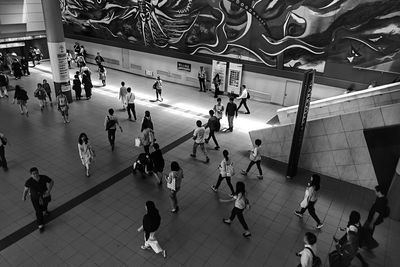 High angle view of people walking in subway station