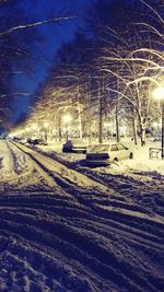 View of illuminated snow covered landscape at night