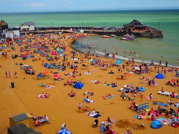 High angle view of people at beach against sky