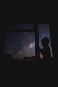 Silhouette of man at night