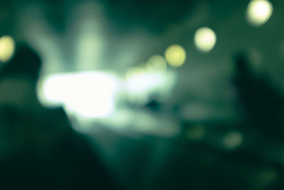 Defocused image of illuminated lights at night