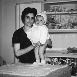 Portrait of mother and daughter at home