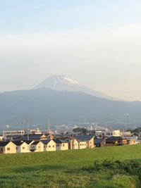 Scenic view of residential district against sky