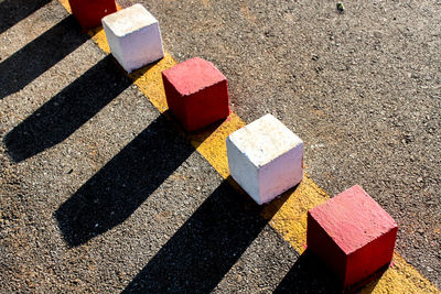 High angle view of multi colored shadow on ground