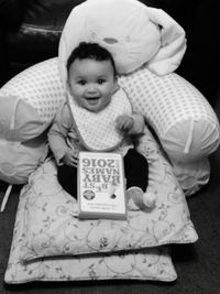 Full length of baby girl with text