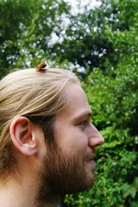 Side view of young man