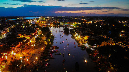 High angle view of illuminated buildings in city at night