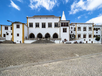 Exterior of building in town against sky