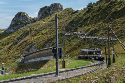 Tram over railroad track on mountain