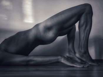 Low section of woman relaxing in water