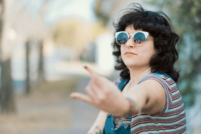 Portrait of woman with cool attitude gesturing