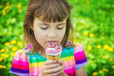 Close-up of girl blowing ice cream