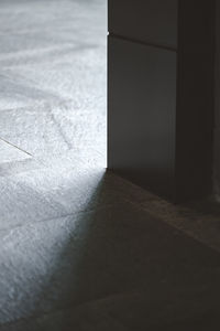 Close-up of sunlight falling on floor in house